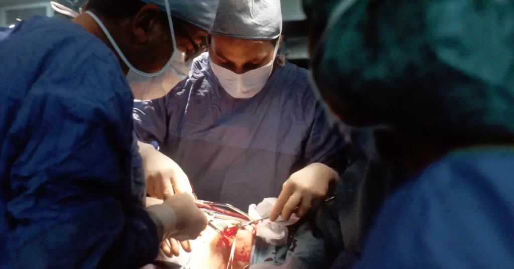Nephrologist performing surgery